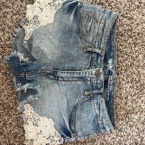Denim shorts with lace detail